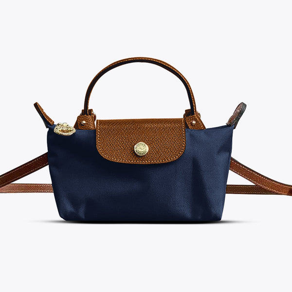 Sac à main en cuir bleu et marron, design élégant avec bandoulière ajustable, idéal pour la mode féminine. Accessoire tendance et chic.