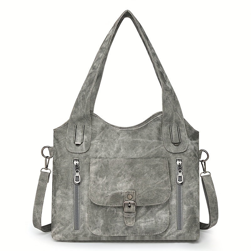 Sac à main en cuir gris avec bandoulière amovible, poches zippées et boucle avant. Élégant et pratique pour femme, idéal pour le quotidien.