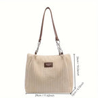 Sac à main beige en velours côtelé avec anses marron, étiquette en cuir, dimensions 29x12x26 cm. Élégant et tendance pour femme.