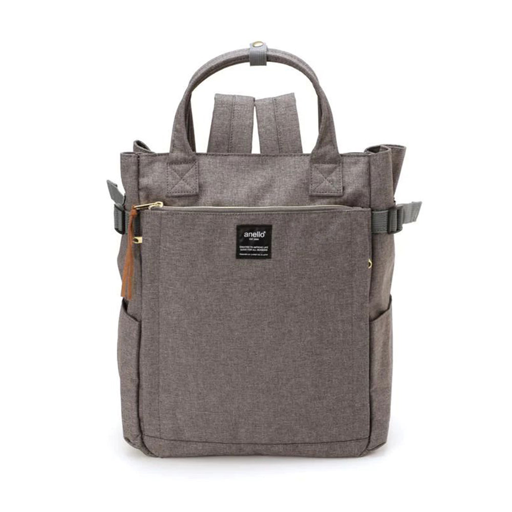 Sac à dos Anello gris en toile, design moderne avec poches multiples, fermeture éclair dorée, idéal pour le voyage et le quotidien.