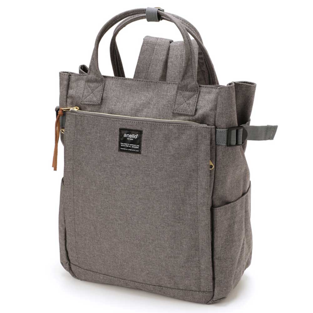 Sac à dos Anello gris, design moderne, poches latérales, fermeture éclair, poignées supérieures, idéal pour voyage, école, usage quotidien.