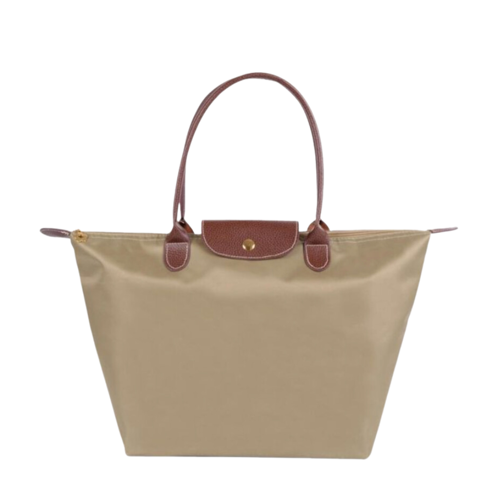 Sac à main beige en toile avec poignées et rabat en cuir marron, style cabas, élégant et pratique pour femme, idéal pour le quotidien.