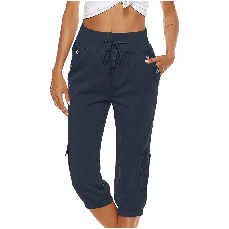 Pantalon cargo femme bleu marine, taille haute, avec cordon de serrage et poches latérales, idéal pour un look décontracté et tendance.