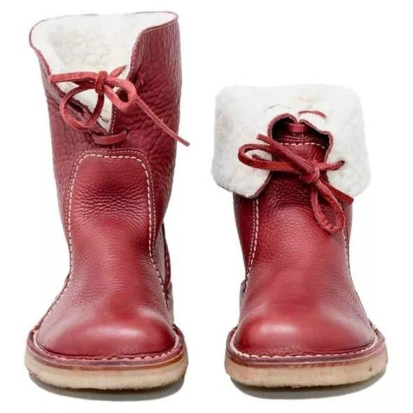 Bottes rouges en cuir pour enfant avec doublure en fourrure blanche, lacets rouges, semelle en caoutchouc. Chaussures d'hiver confortables et stylées.