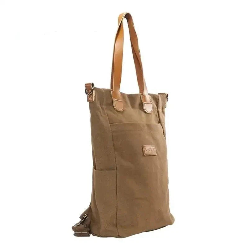 Sac fourre-tout en toile marron avec anses en cuir, design vertical élégant, idéal pour le shopping ou le quotidien. Accessoire mode pratique et tendance.