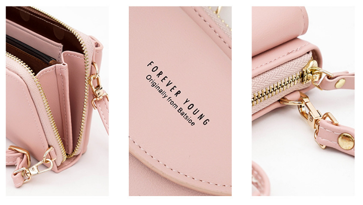 Sac à main rose en cuir synthétique avec fermeture éclair dorée, bandoulière amovible, et inscription "Forever Young". Accessoire mode tendance.