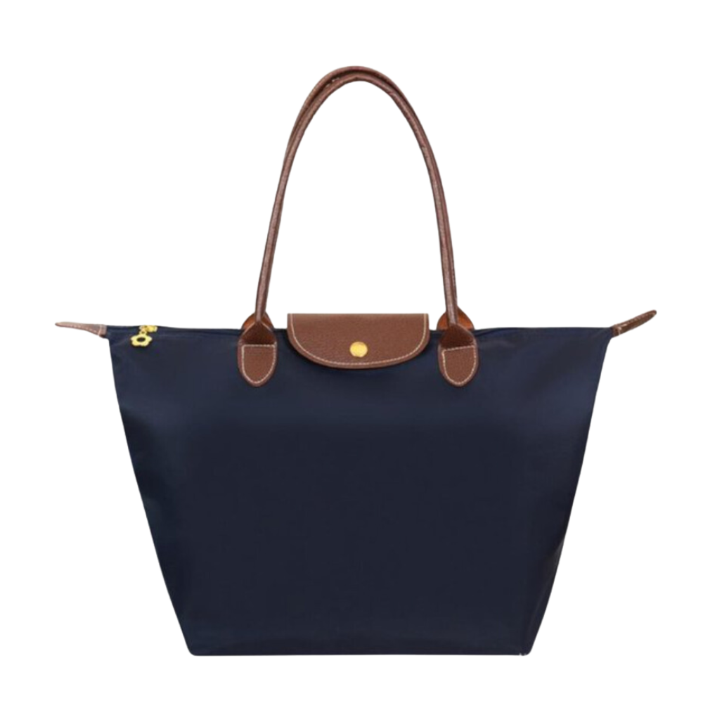 Sac à main en nylon bleu marine avec poignées en cuir marron, design élégant et pratique, idéal pour la mode féminine et le quotidien.