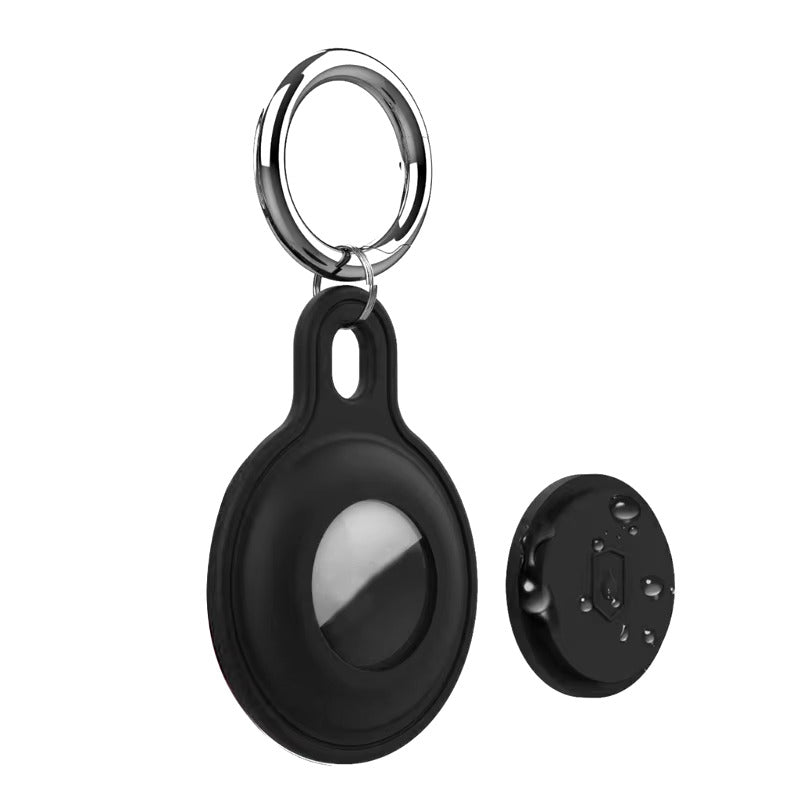 Porte-clés noir avec traqueur GPS rond, design moderne, idéal pour localiser objets perdus. Accessoire pratique et tendance pour sécurité personnelle.