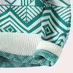 Pull en tricot vert et blanc avec motif géométrique, manches longues, col rond. Mode hiver, style scandinave, tendance vêtements chauds.