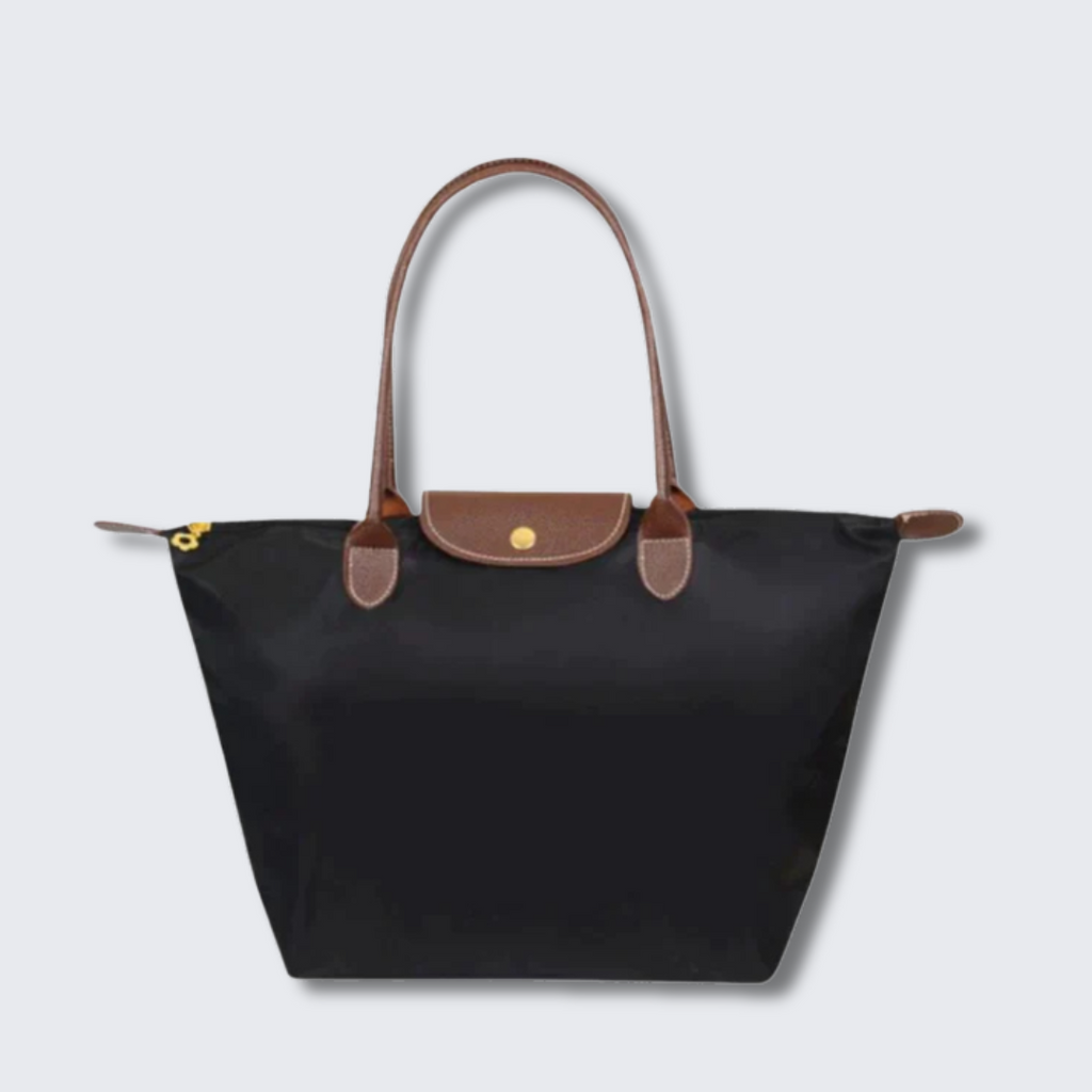Sac à main noir en nylon avec poignées en cuir marron, design élégant et pratique, idéal pour le quotidien et les voyages.
