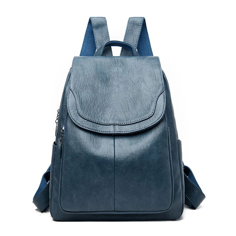 Sac à dos en cuir bleu élégant avec bretelles ajustables, poche frontale zippée, design moderne. Accessoire mode pratique pour femmes.