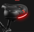 Selle de vélo ergonomique noire avec lumière LED rouge intégrée, design confortable, idéale pour cyclisme nocturne, sécurité accrue.
