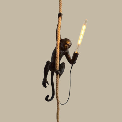 Lampe pendante singe en résine avec détails de corde