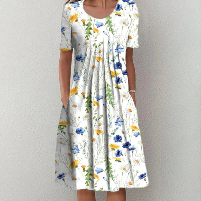 Robe d'été femme à manches courtes, imprimé floral coloré sur fond blanc, style décontracté et élégant, idéale pour la saison estivale.