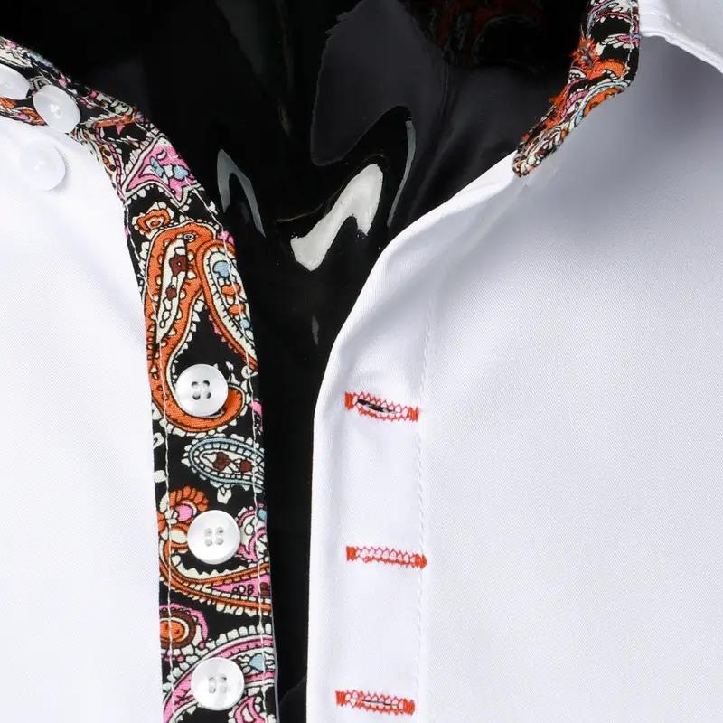 Chemise blanche élégante avec col et patte de boutonnage à motifs paisley colorés, boutons blancs, couture rouge. Mode masculine chic et tendance.