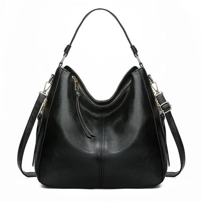 Sac à main noir en cuir élégant avec bandoulière réglable, fermeture éclair dorée et design moderne. Accessoire mode femme chic et pratique.