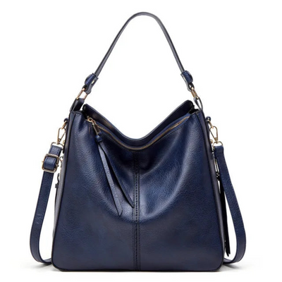 Sac à main en cuir bleu marine élégant avec bandoulière réglable et fermeture éclair dorée, parfait pour un style chic et moderne.