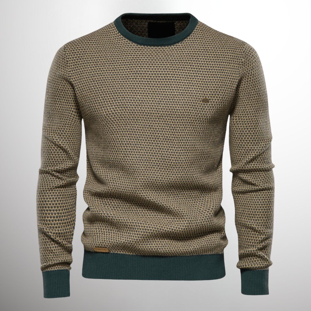 Pull-over en maille beige à motif géométrique, col rond et poignets côtelés verts, style moderne et élégant pour homme. Mode automne-hiver.