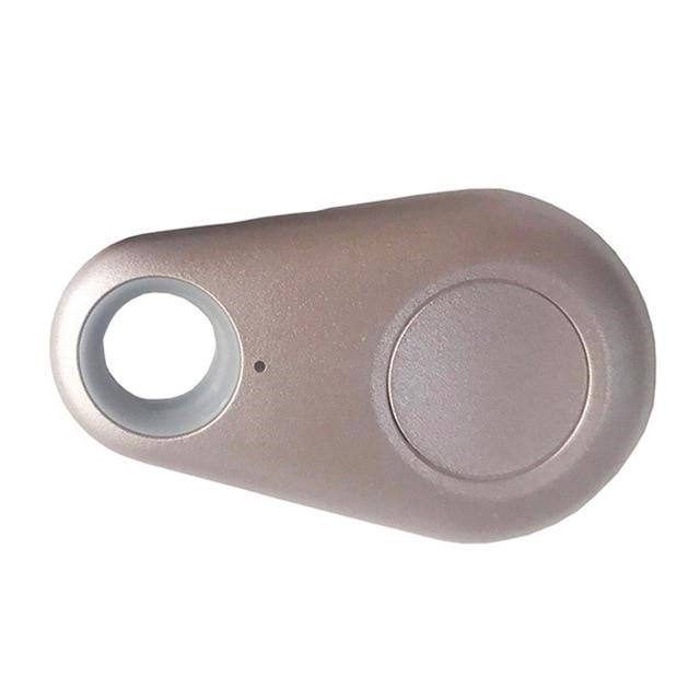 Traceur Bluetooth gris en forme de goutte, idéal pour localiser clés et objets perdus. Accessoire pratique pour suivi GPS personnel.