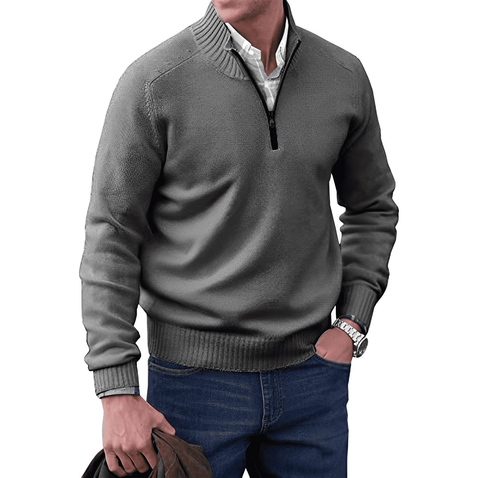 Homme portant un pull gris à col zippé, chemise blanche et jeans bleu, tenant une veste marron. Mode masculine élégante et décontractée.