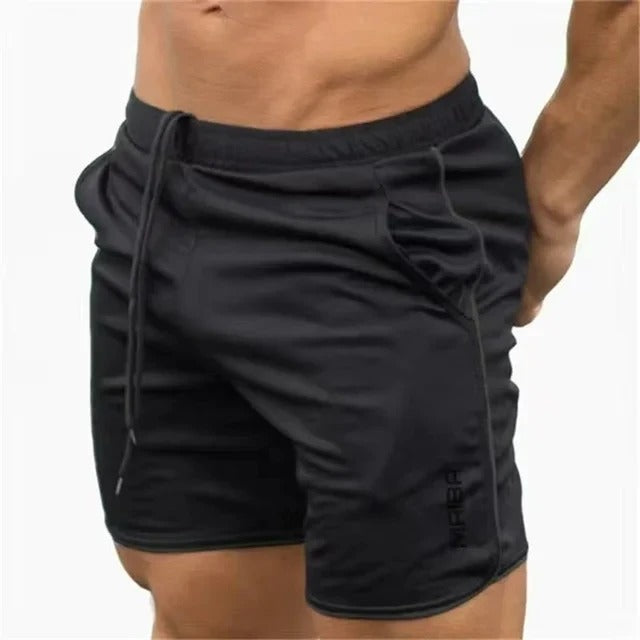 Short de sport noir pour homme, ajusté, avec cordon de serrage et poches latérales. Idéal pour fitness, entraînement, gym. Confort et style.