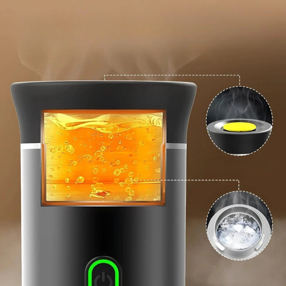 Diffuseur d'arômes noir avec écran affichant liquide orange pétillant, vapeur visible. Design moderne, technologie ultrasonique, ambiance relaxante.
