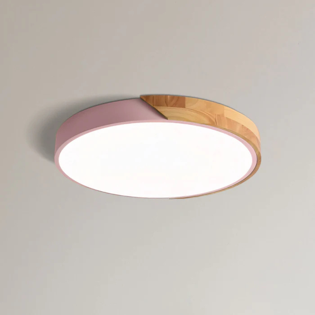 Plafonnier LED rond moderne, design minimaliste, couleur rose et bois, éclairage intérieur, décoration plafond, style contemporain élégant.