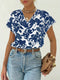 Blusa floral con escote en pico