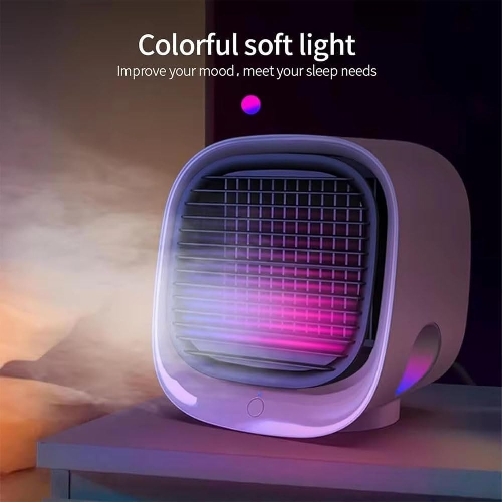 Mini climatiseur portable avec lumière LED colorée, posé sur une table. Idéal pour rafraîchir et créer une ambiance relaxante.