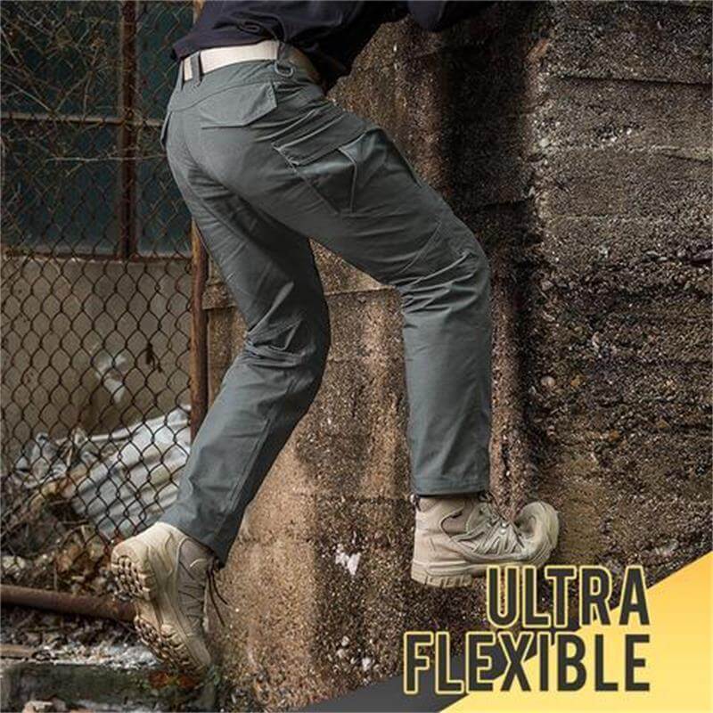 Pantalon cargo gris ultra flexible pour homme, idéal pour l'escalade et les activités extérieures, offrant confort et liberté de mouvement.
