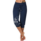 Pantalon capri bleu marine pour femme avec motif pissenlit blanc, taille élastique, cordon de serrage, mode décontractée, confortable et stylé.