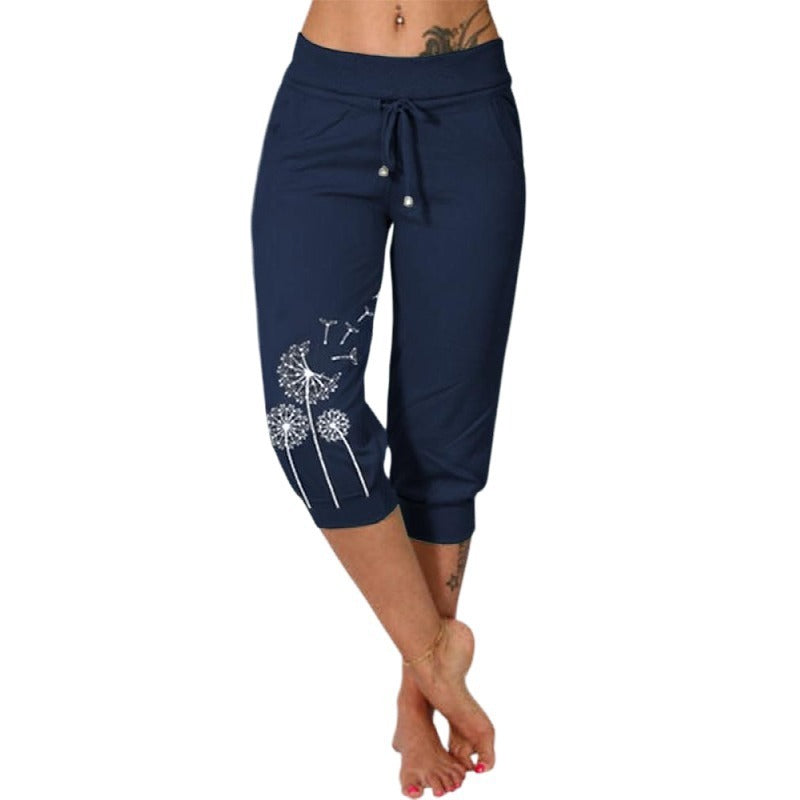 Pantalon capri bleu marine pour femme avec motif pissenlit blanc, taille élastique, cordon de serrage, mode décontractée, confortable et stylé.
