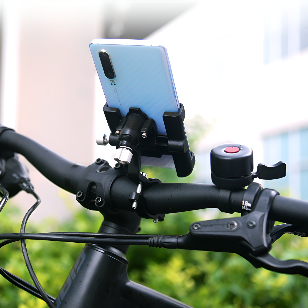 Support téléphone vélo fixé sur guidon noir, smartphone bleu en position verticale, sonnette rouge à côté. Accessoire cyclisme pratique et sécurisé.