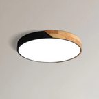 Plafonnier LED moderne rond, design bicolore noir et bois, éclairage intérieur élégant, idéal pour salon ou chambre, style contemporain.