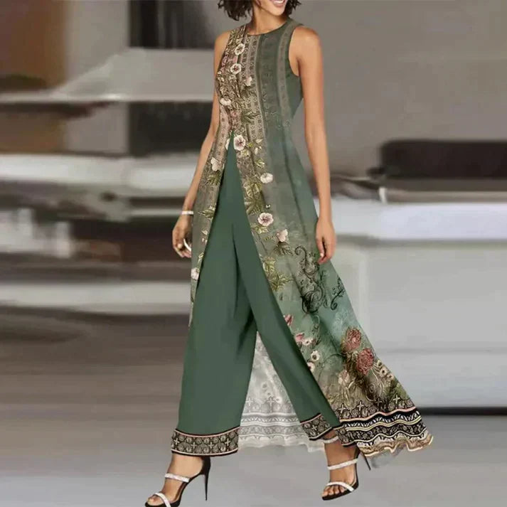 Robe longue verte élégante avec motifs floraux, dentelle blanche, portée par une femme. Mode féminine chic, tenue de soirée tendance.