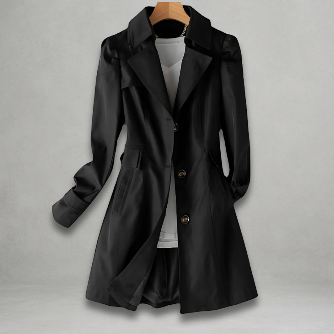 Manteau noir élégant pour femme sur cintre, style trench-coat, avec boutons dorés et col large. Mode automne-hiver, vêtement chic et tendance.