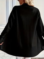 Striktrøje med rund halsudskæring og afslappet pasform til kvinder