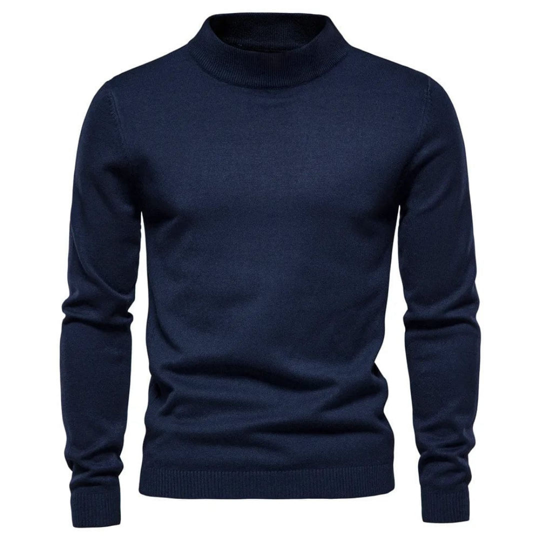Pull-over col roulé bleu marine pour homme, manches longues, en laine douce. Mode masculine élégante, vêtement d'hiver chaud et confortable.