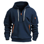 Sweat à capuche bleu marine avec poches zippées orange, cordons gris, manches longues, style décontracté. Mode homme, vêtement tendance.