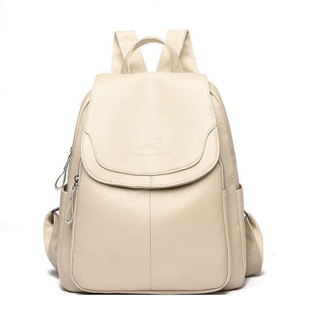Sac à dos en cuir beige élégant avec poches latérales et fermeture éclair, idéal pour femmes. Accessoire mode pratique et tendance.
