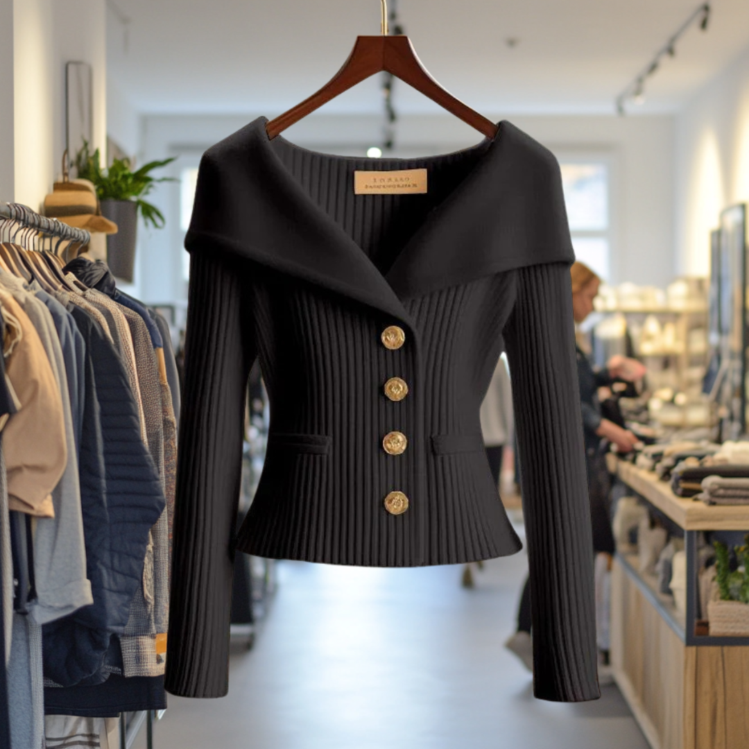 Veste noire élégante avec boutons dorés, exposée dans une boutique de mode moderne. Vêtements tendance, style chic, prêt-à-porter féminin.