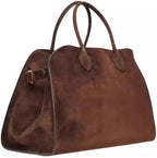 Sac à main en cuir marron, design élégant et spacieux, idéal pour la mode féminine. Accessoire tendance pour un look chic et sophistiqué.