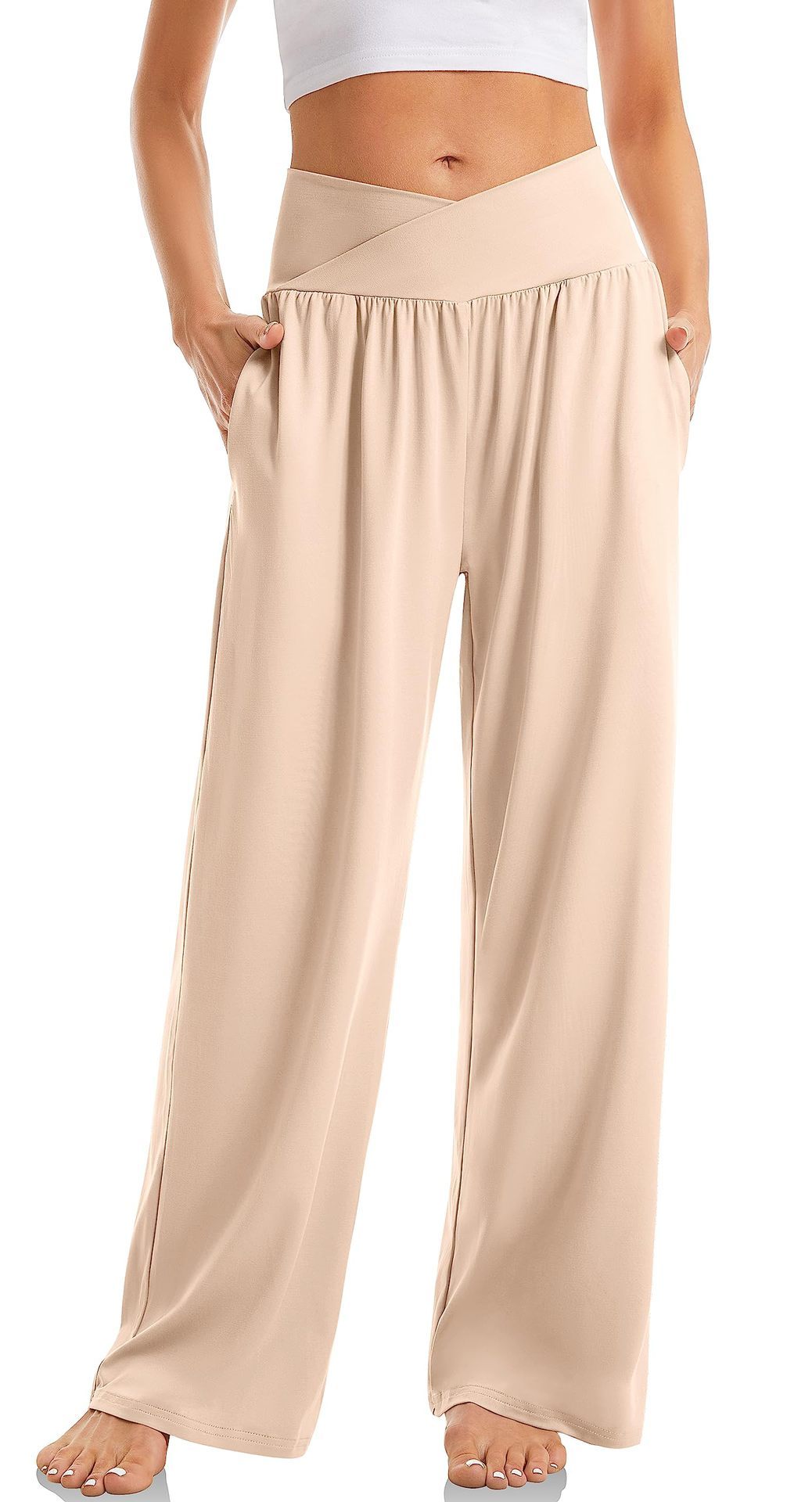 Pantalon large beige taille haute pour femme, style décontracté, avec poches latérales. Mode féminine, confort, vêtement tendance.