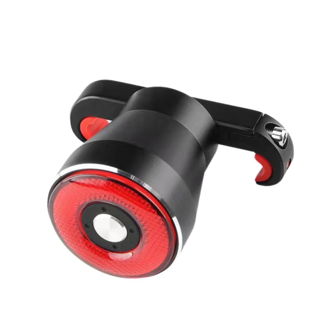 Lampe de vélo LED rouge, rechargeable USB, avec support rotatif. Éclairage arrière pour sécurité cycliste, design compact et moderne.