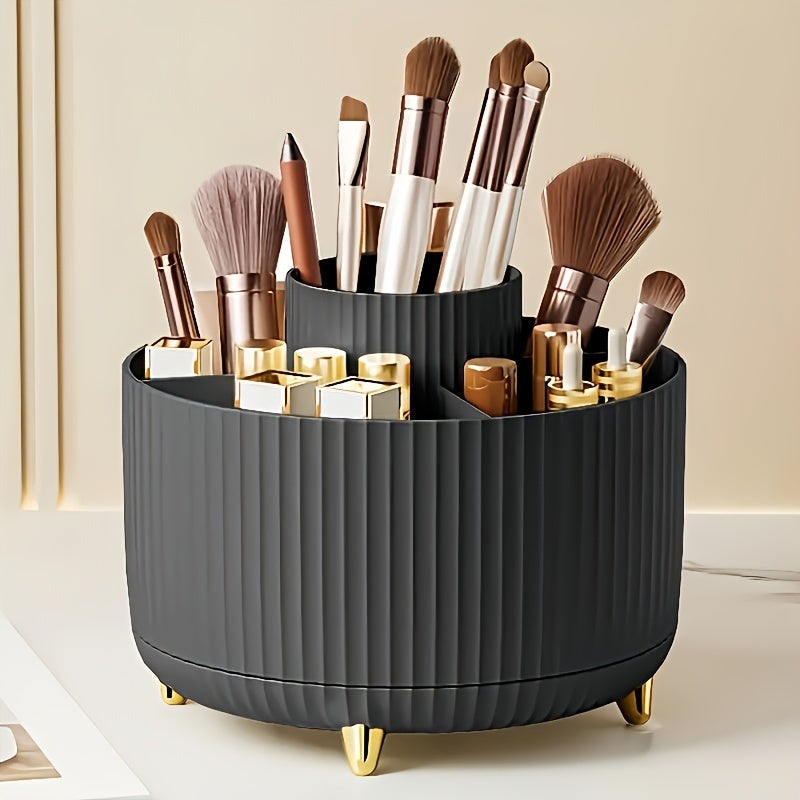 Organisateur de maquillage noir avec pinceaux et rouges à lèvres, design moderne, pieds dorés, idéal pour rangement cosmétique sur coiffeuse élégante.