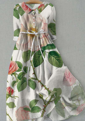 Robe longue blanche à motifs floraux roses et verts, manches trois-quarts, col chemise, ceinture à nouer, style élégant et printanier.