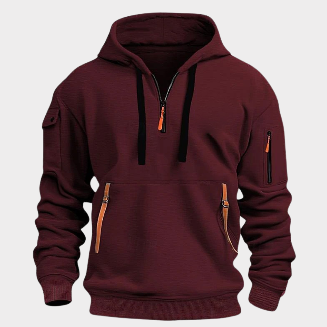 Sweat à capuche bordeaux pour homme avec fermeture éclair, poches zippées et manches longues. Mode décontractée, tendance automne-hiver.