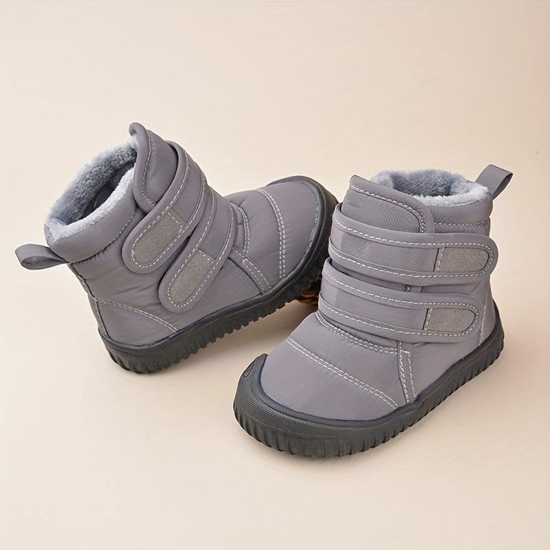 Bottes d'hiver pour enfants en gris, doublure en fourrure, semelle antidérapante, fermeture à scratch, chaussures chaudes et imperméables pour l'hiver.
