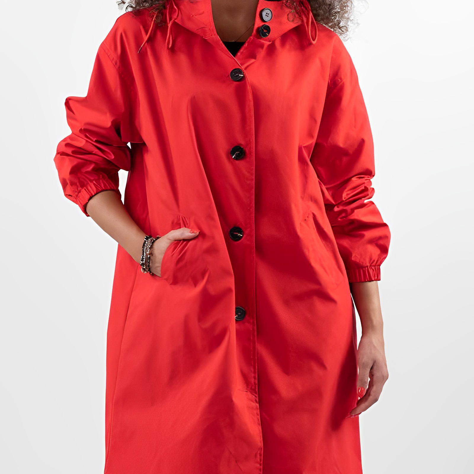 Manteau rouge vif pour femme avec boutons noirs, manches longues et poches, style moderne et élégant, mode automne-hiver tendance.