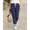 Pantalón casual de mujer en tejido transpirable con corte 7/8 y cintura elástica.